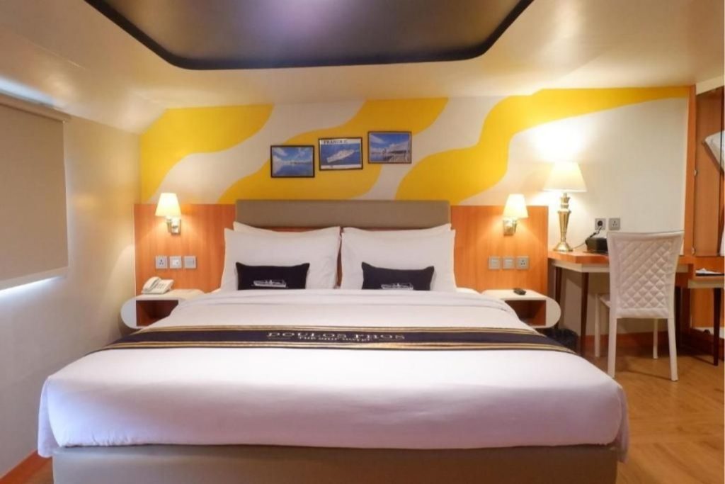 Cozy cabin-style room at Doulos Phos The Ship Hotel