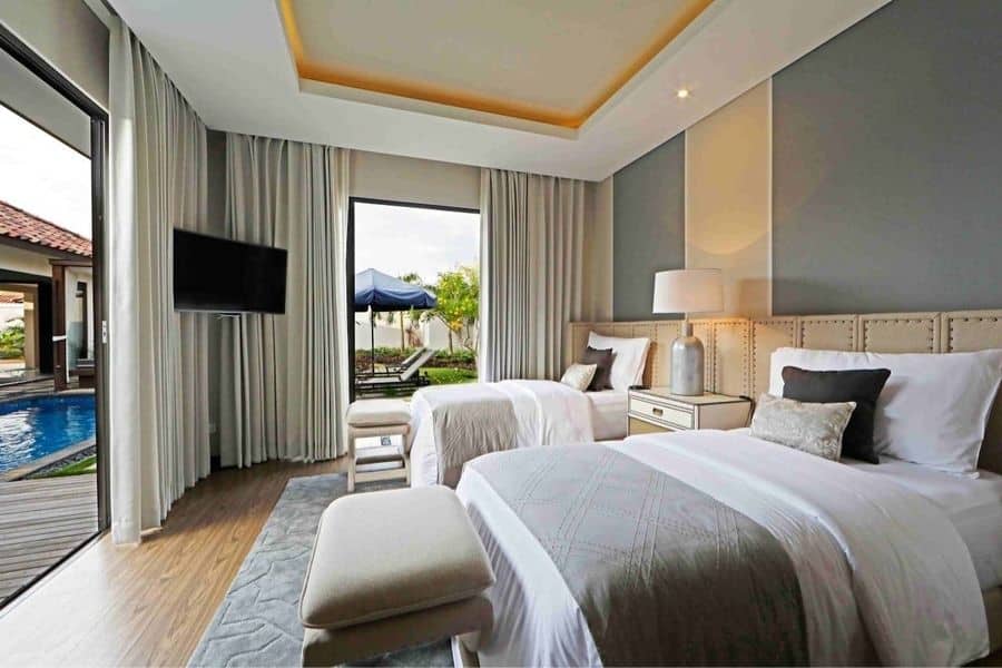 Twin beds inside two bedroom villa