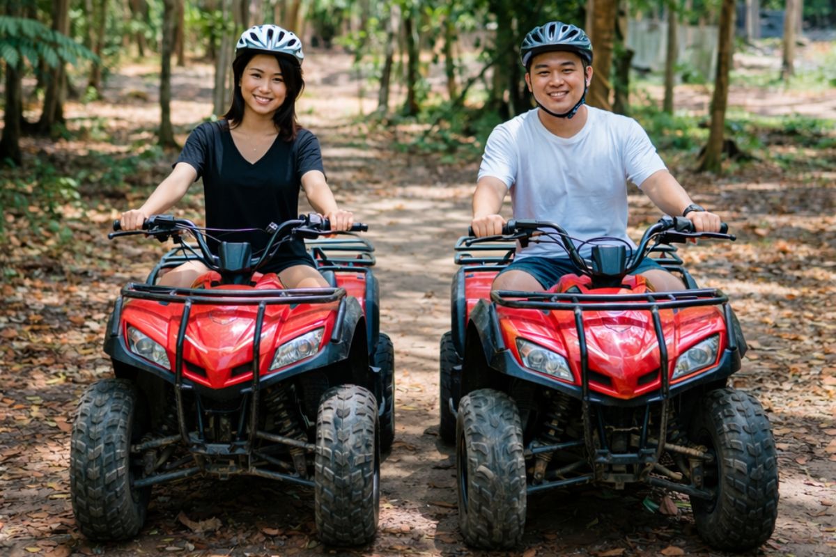 Couple on ATV in Bintan plantation area preparing for off-road ride